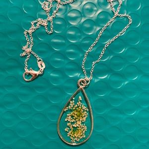 Silver necklace with white pressed flower in bezel